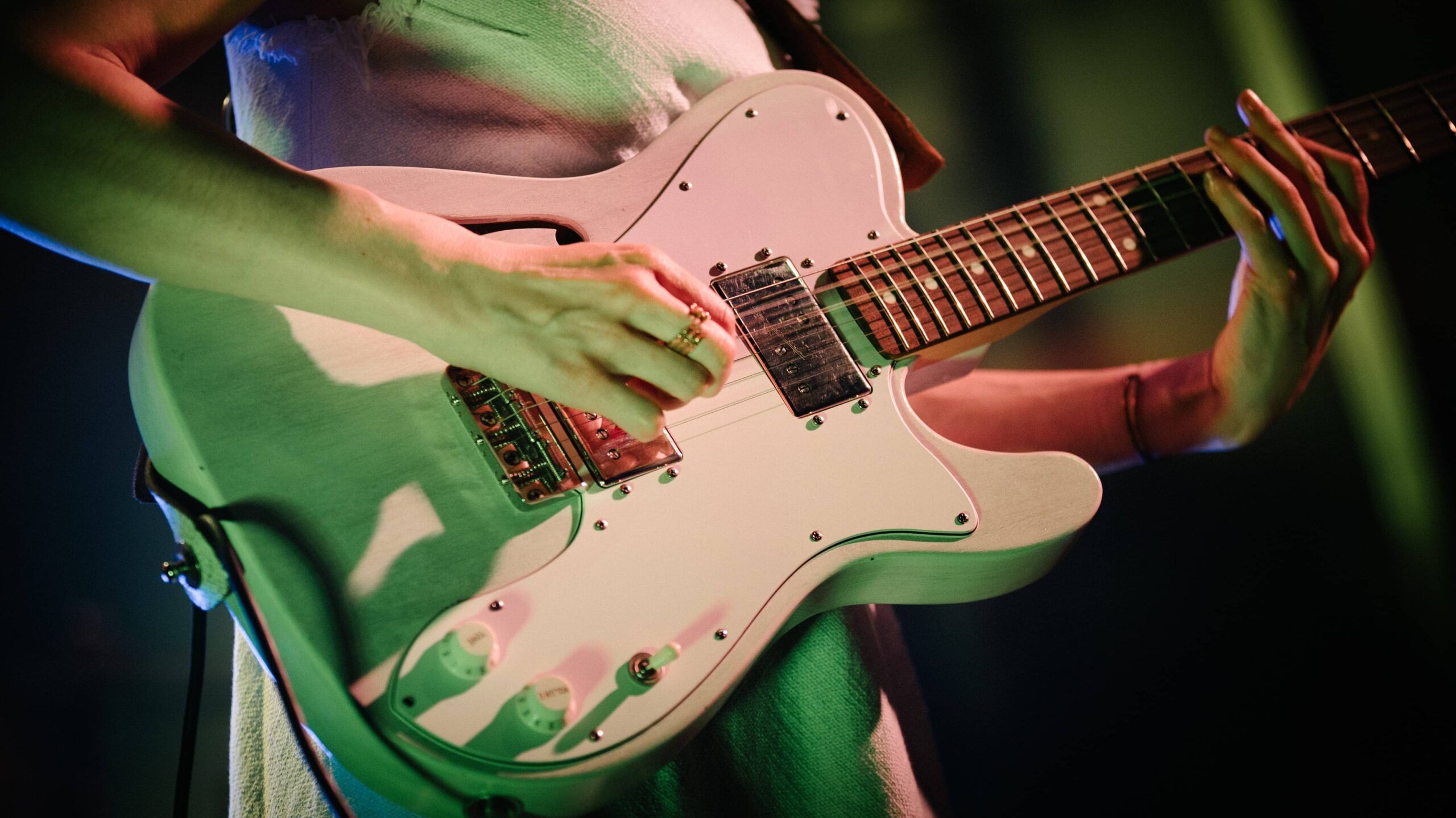 Close up of white electric guitar